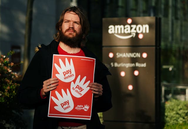 <p>Activist Dylan Murphy outside Amazon’s European headquarters in Dublin</p>