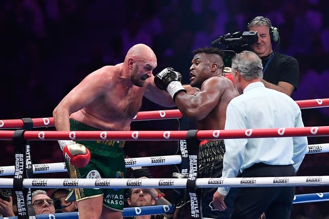 Tyson Fury, left, struggled badly against Francis Ngannou (Yazeed Aldhawaihi/AP)