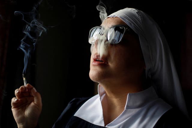 <p>A member of Sisters of the Valley, a non-religious international group founded in 2014, smokes a joint at the group’s farm on the outskirts of a village in central Mexico</p>