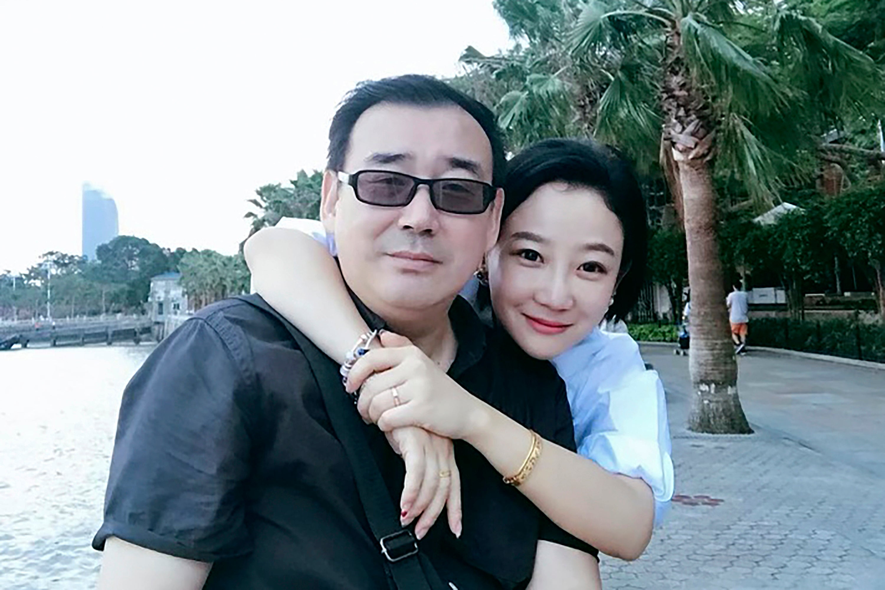 This undated file photo released by Chongyi Feng shows Yang Hengjun, left, and his wife Yuan Xiaoliang