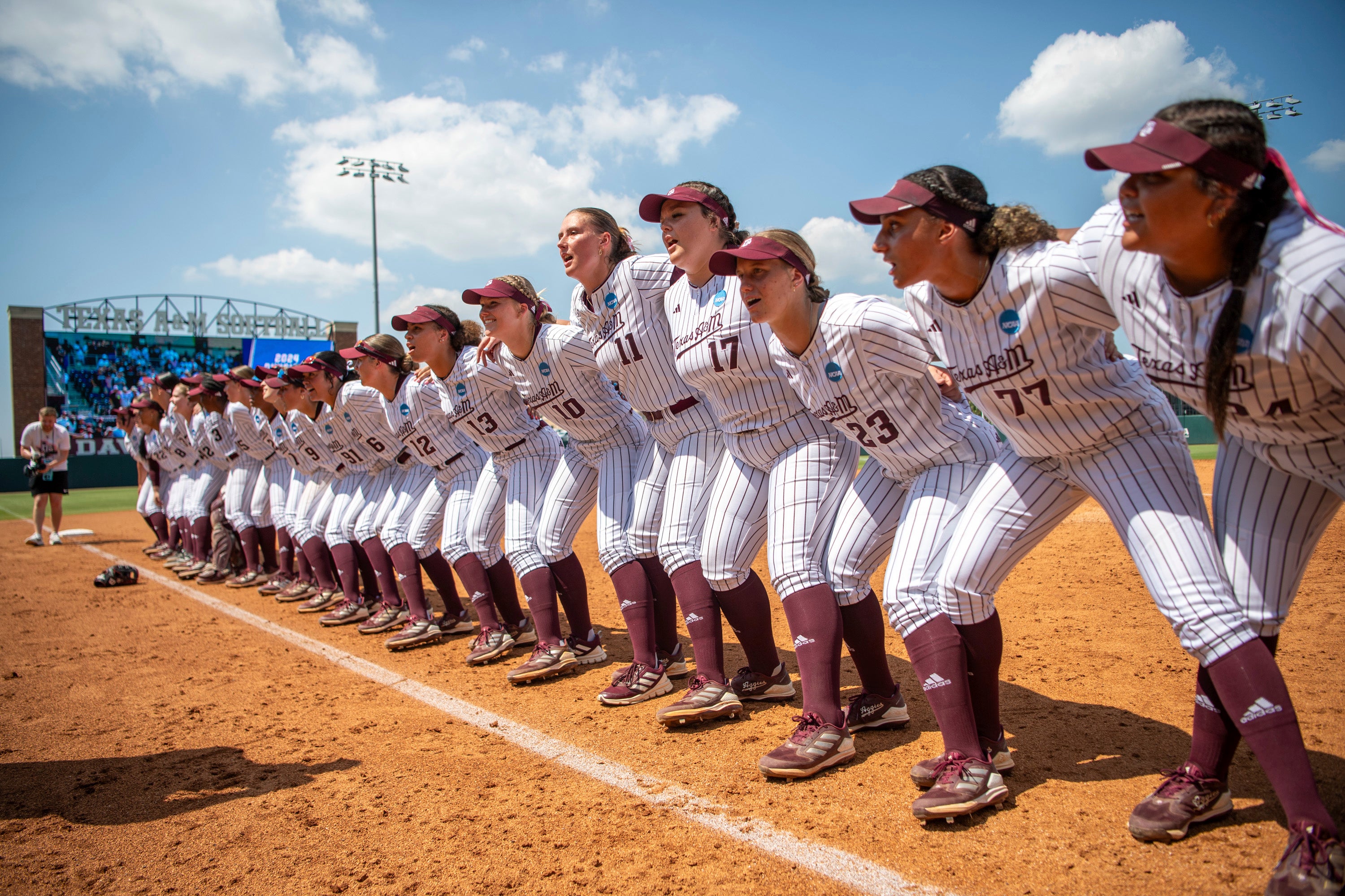 The Texas A&M softball team sings the Aggie War Hymn after the win during the NCAA Division I regional final softball game against Texas State on Sunday, May 19, 2024