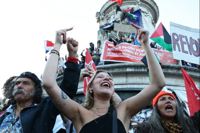 <p>People attend a gathering for the election night following the second round results of France's legislative election at Republique Square in Paris</p>