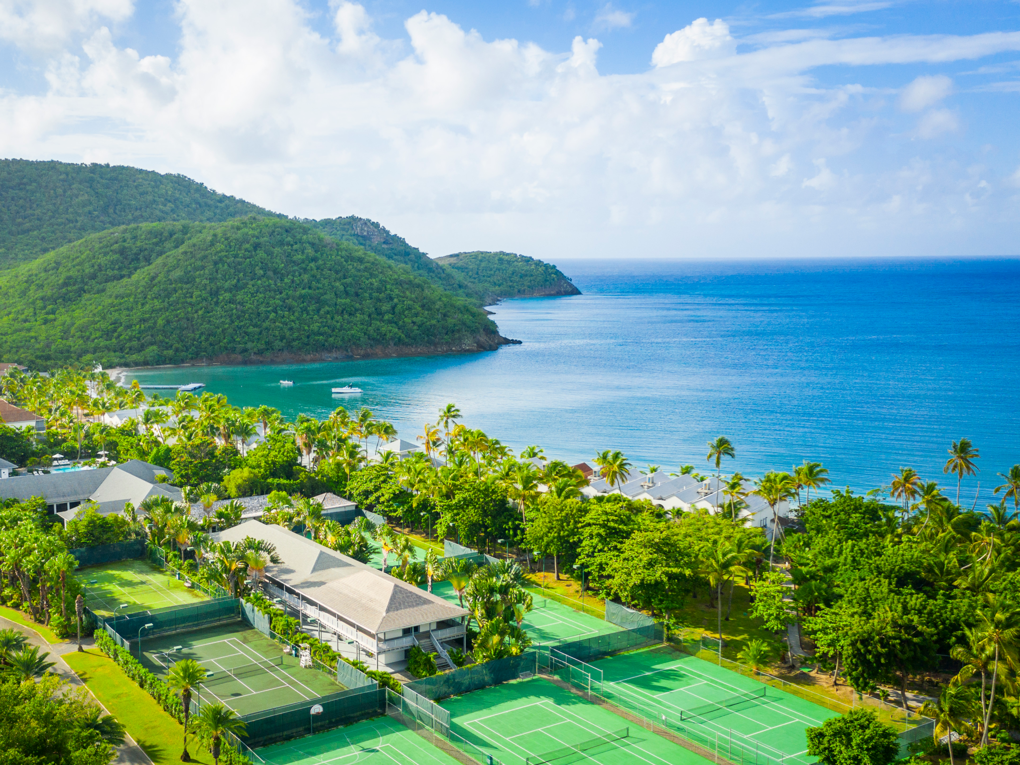 Serve with sea views in this lush tropical resort