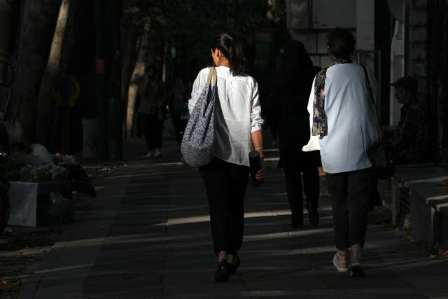 <p>An Iranian women not wearing their mandatory headscarf, or hijab,  in Tehran, Iran</p>