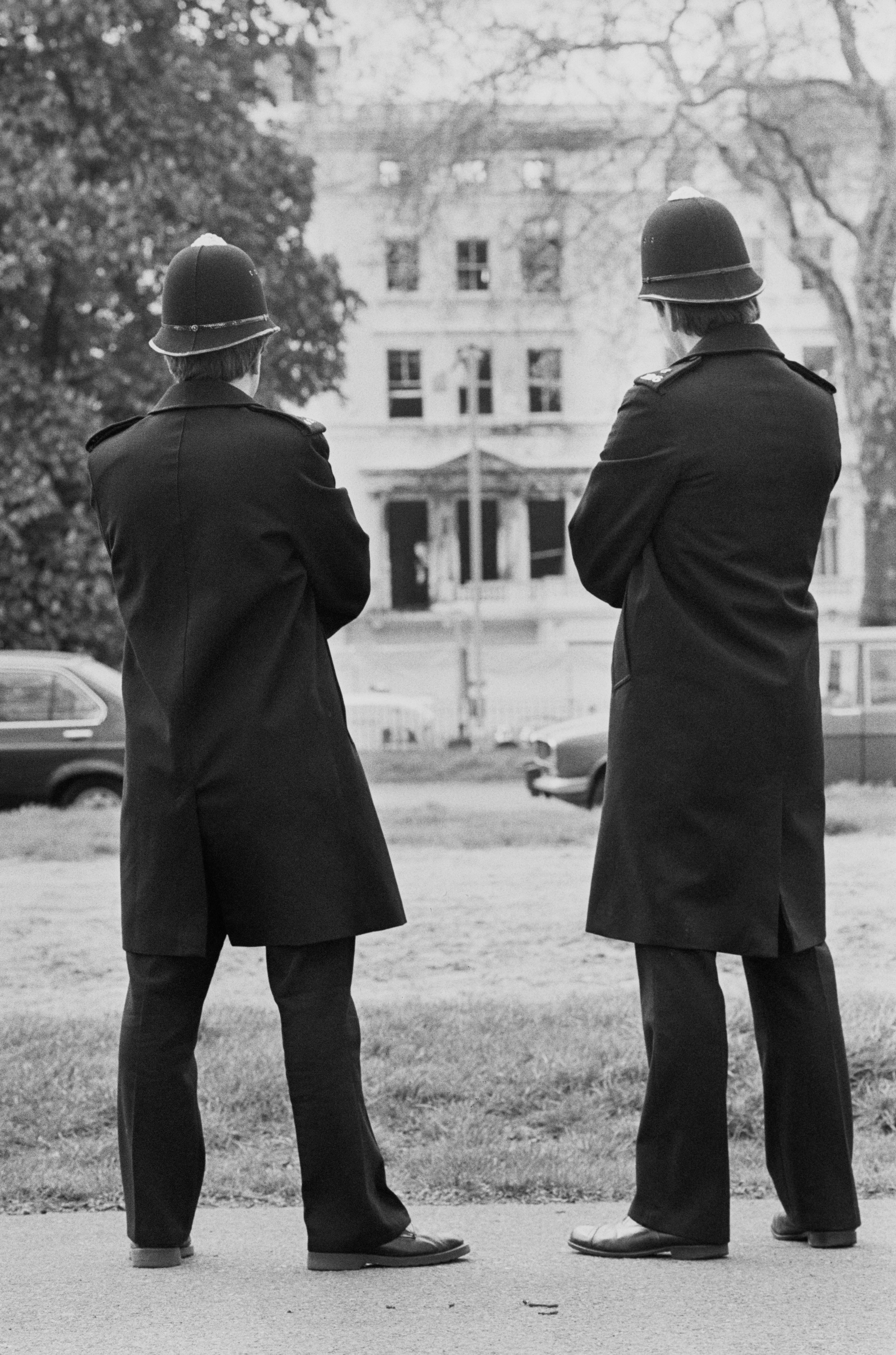 Two police officers guard the Iranian embassy following the siege, on 7 May 1980