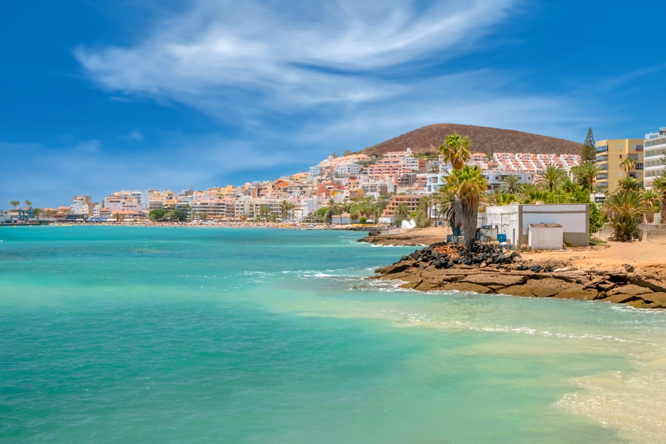 Bay of turquoise-coloured water in Los Cristianos, Tenerife, Canary Islands