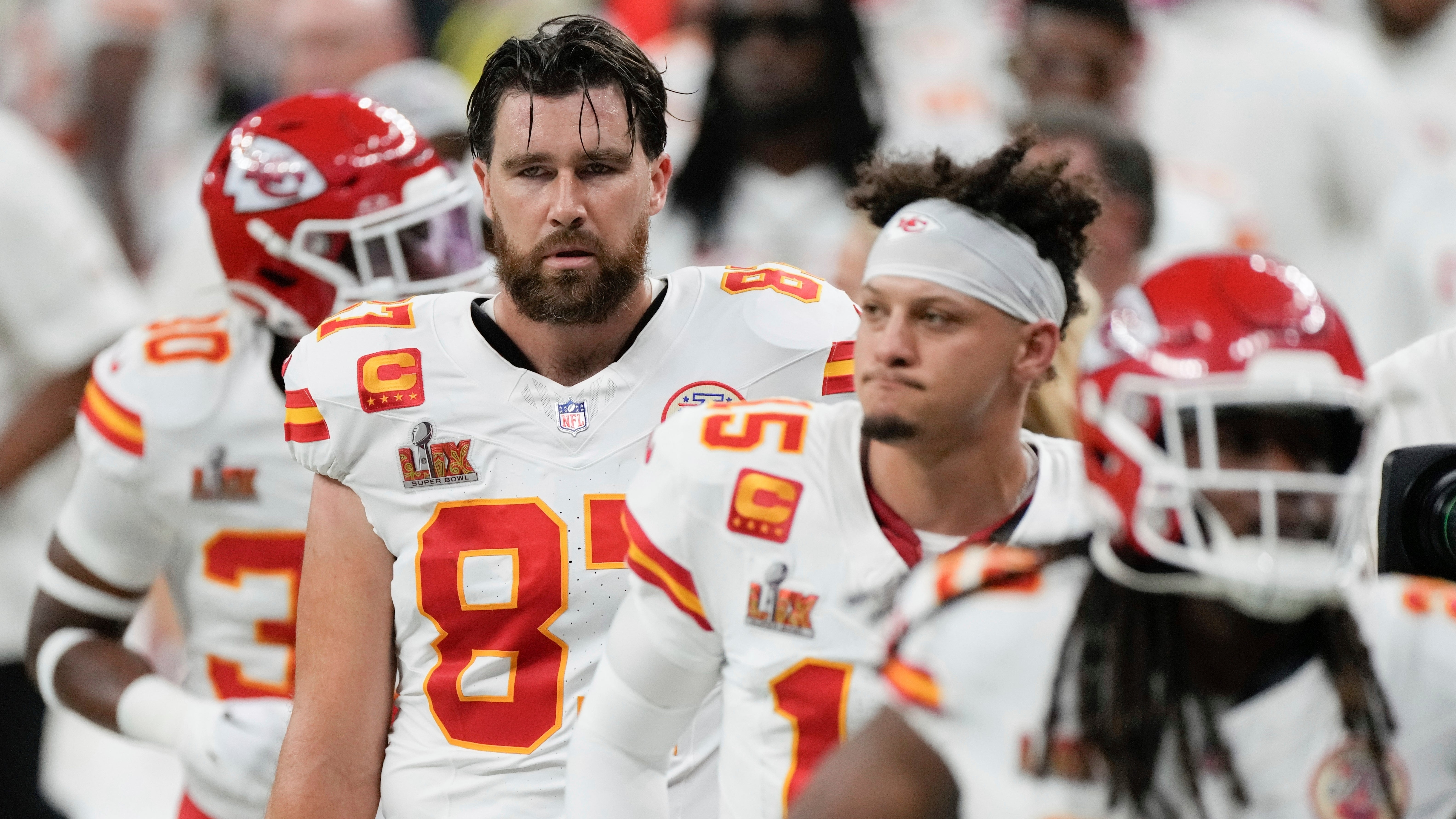 Kansas City Chiefs tight end Travis Kelce (left) and quarterback Patrick Mahomes walk off the field at the halftime break