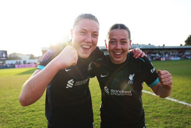 <p>Liverpool's Sophie Roman Haug celebrates with Cornelia Kapocs</p>