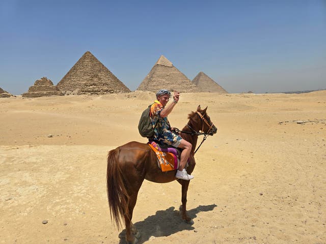<p>Terry did many bucket list things, including riding a horse around the pyramids</p>