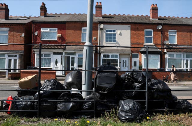 <p>Rubbish bins have not been collected since a strike began on 11 March </p>