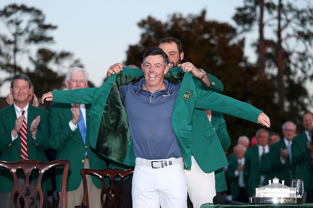 Defending champion Scottie Scheffler puts the green jacket on career grand slam-winner McIlroy