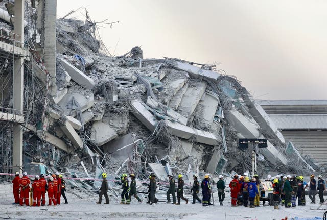 <p>Rescuers work at the site a high-rise building under construction that collapsed after an earthquake, in Bangkok, Thailand, on March 28, 2025.</p>