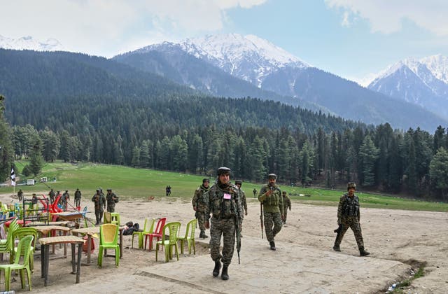 <p>Indian security officers inspect the site in Pahalgam where militants indiscriminately opened fired at tourists on Tuesday, Pahalgam</p>