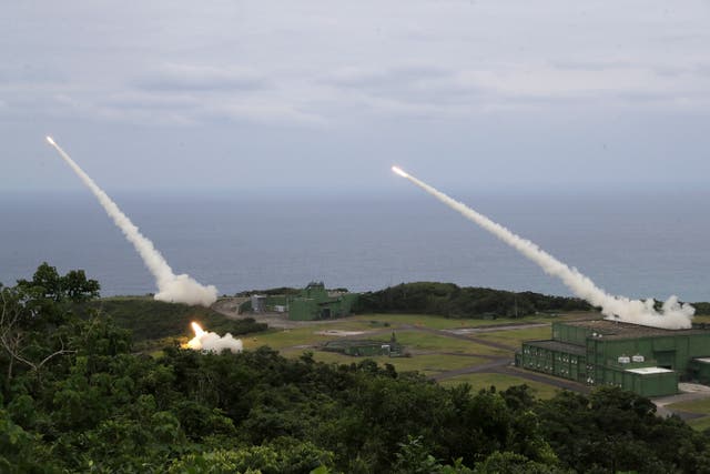 <p>Rocket practice rounds are launched from M142 High Mobility Artillery Rocket System (HIMARS) during a testing drill in Pingtung County, Southern Taiwan</p>